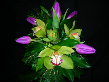 orchids with tulips and greenery