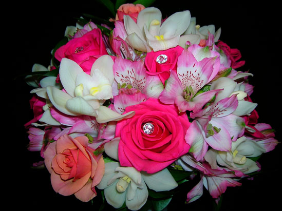 bejwelled pink roses, coral roses with alstramaria and white orchids